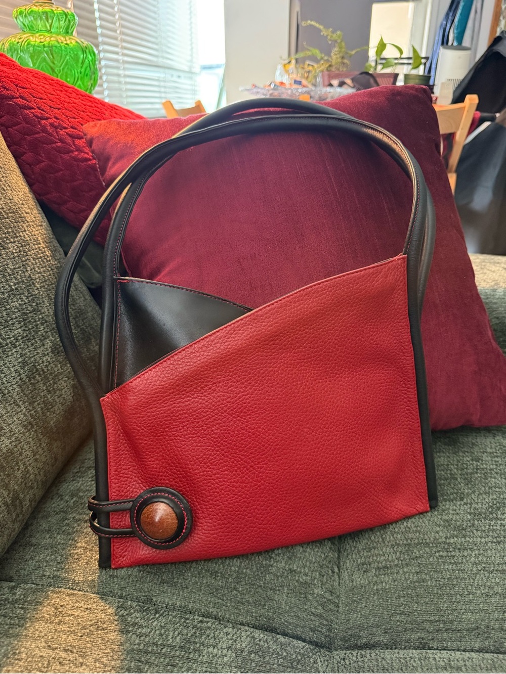 Two-Tone Red and Black Shoulder Bag with Decorative Button